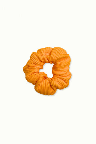 Orange scrunchie on a white background